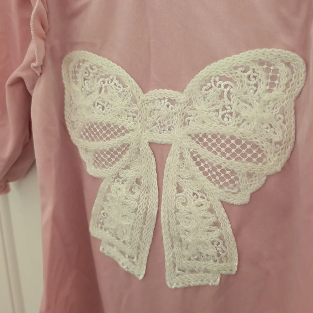 $ Pink Velour Jumpsuit With‎ Ruffle And Lace Bow Detail